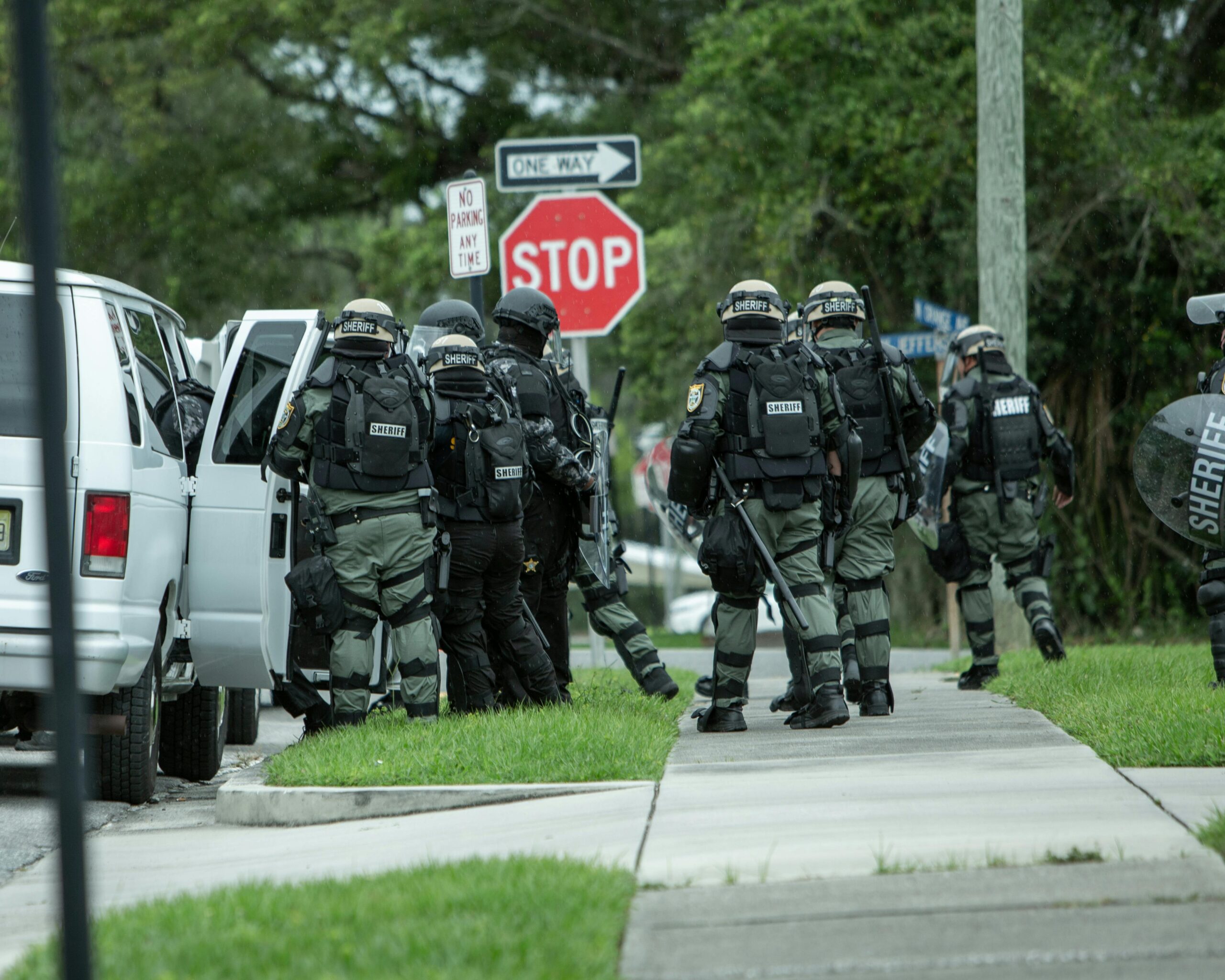 Police tactical unit in action during operation on a street in Brooksville, FL.